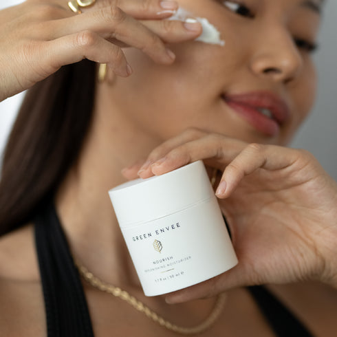 person holding NOURISH REPLENISHING MOISTURIZER 50ML